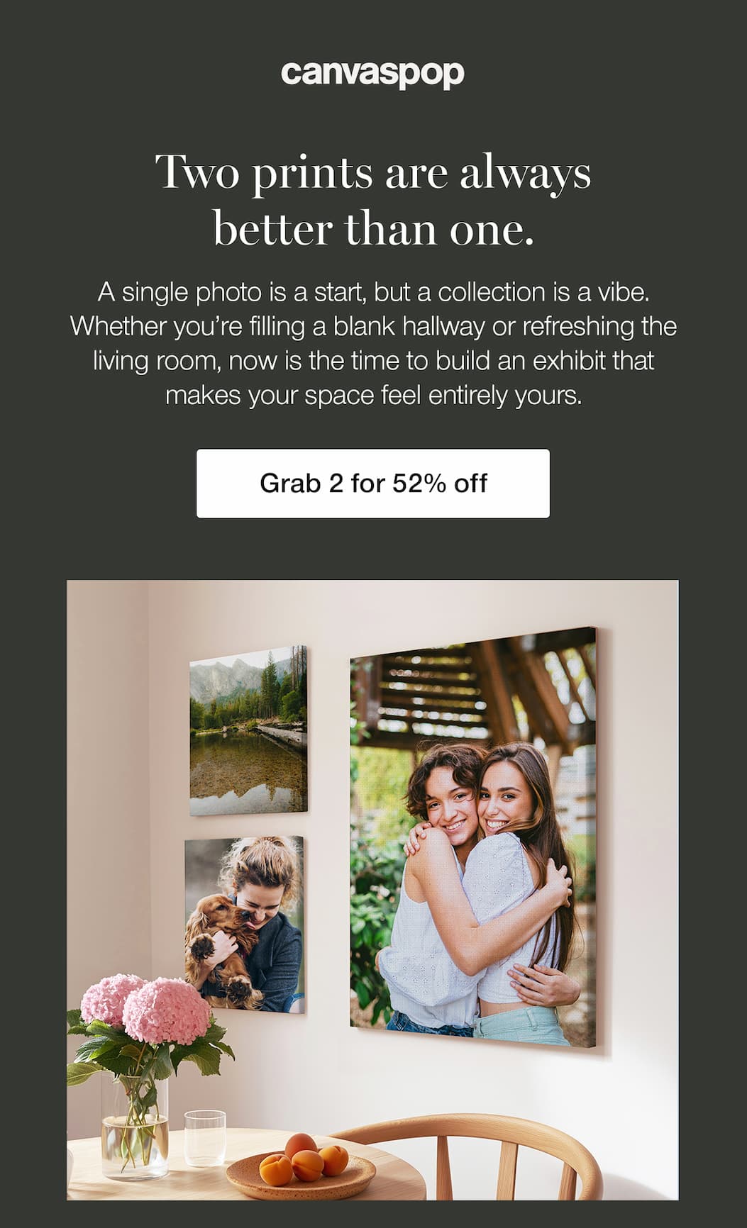 Three canvas prints on a wall beside a kitchen table.