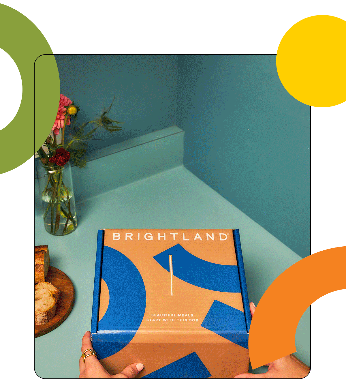 A picture of a nicely designed Brightland gift box being opened with two olive oils inside. A picture of a nicely designed Brightland gift box being opened with two olive oils inside.