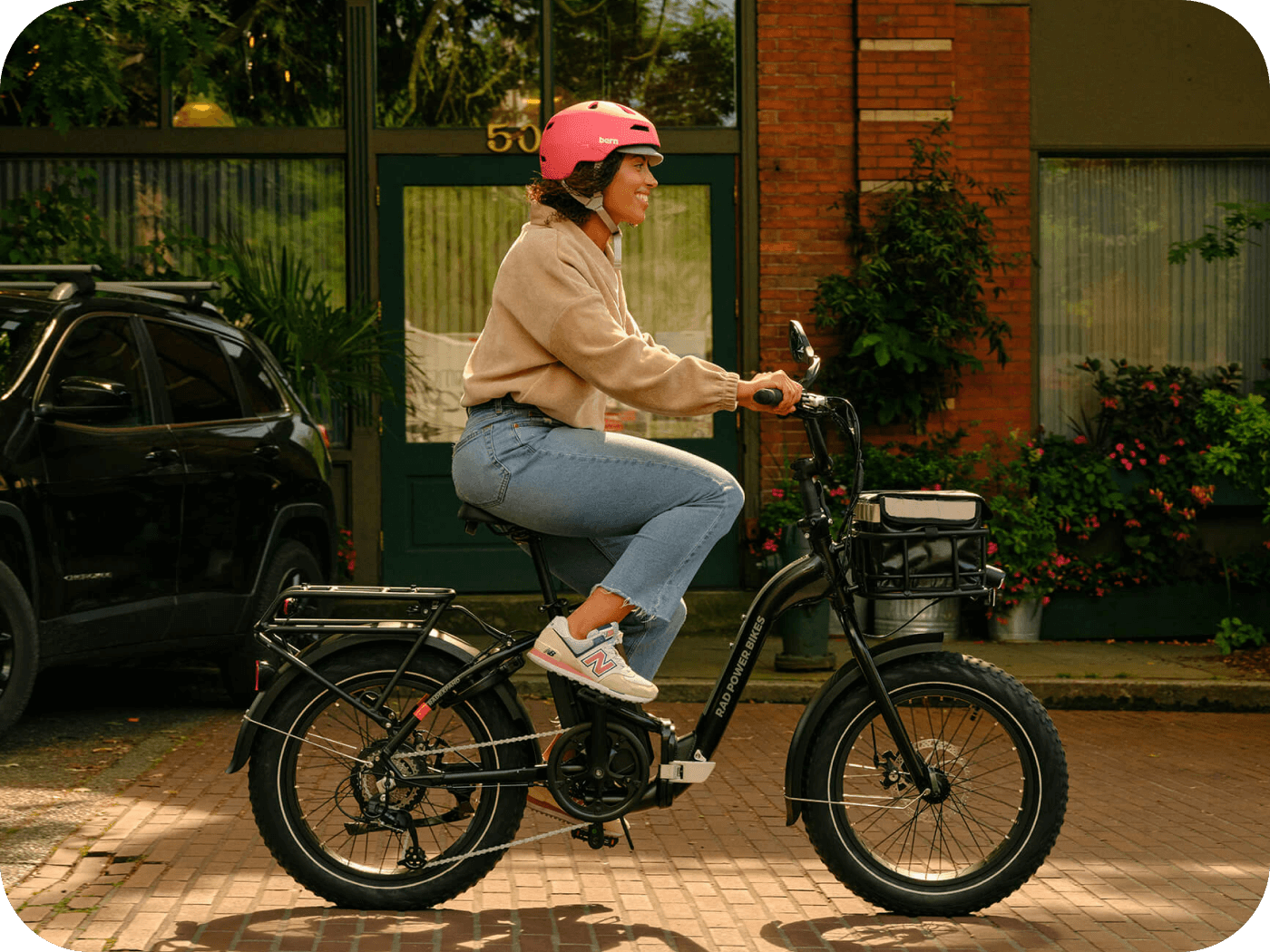 Person riding RadExpand ebike outdoors