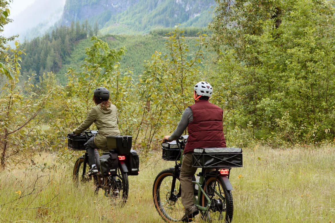 2 bikers with waterproof gear, wrist seals, rain pants and helmet