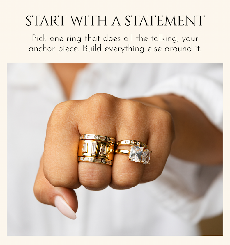 START WITH A STATEMENT: Pick one ring that does all the talking, your anchor piece. Build everything else around it.