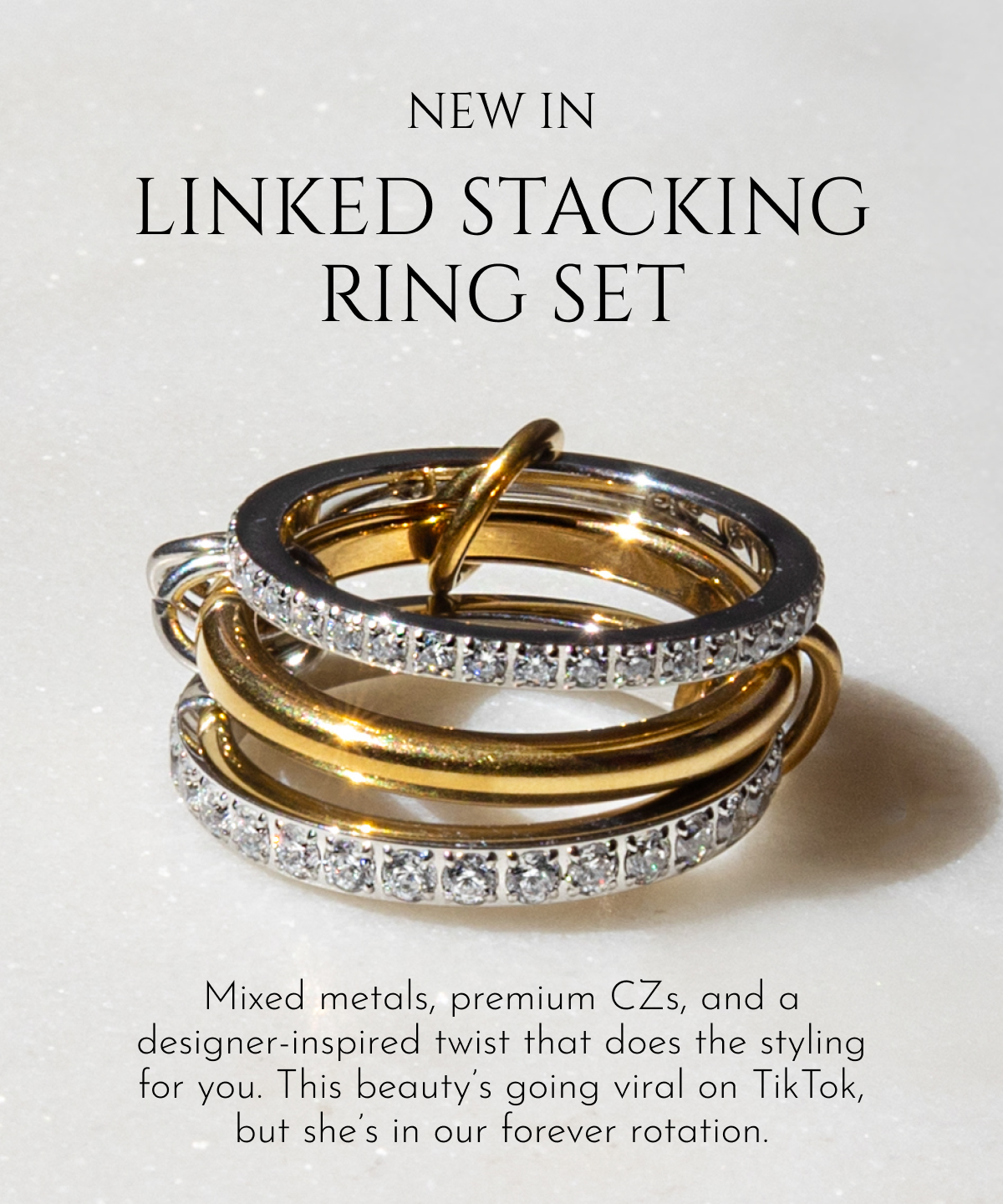 NEW IN: Linked Stacking Ring Set | Mixed metals, premium CZs, and a designer-inspired twist that does the styling for you. This beauty's going viral on TikTok, but she's in our forever rotation.