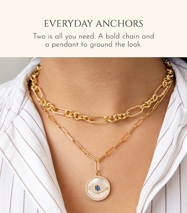 EVERYDAY ANCHORS Two is all you need. A bold chain and a pendant to ground the look.