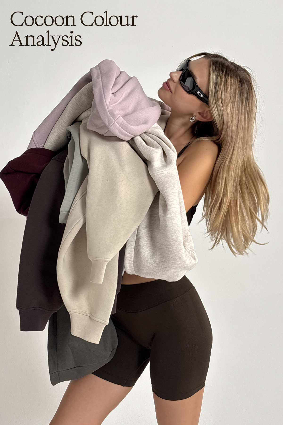 model carrying lots of cocoons