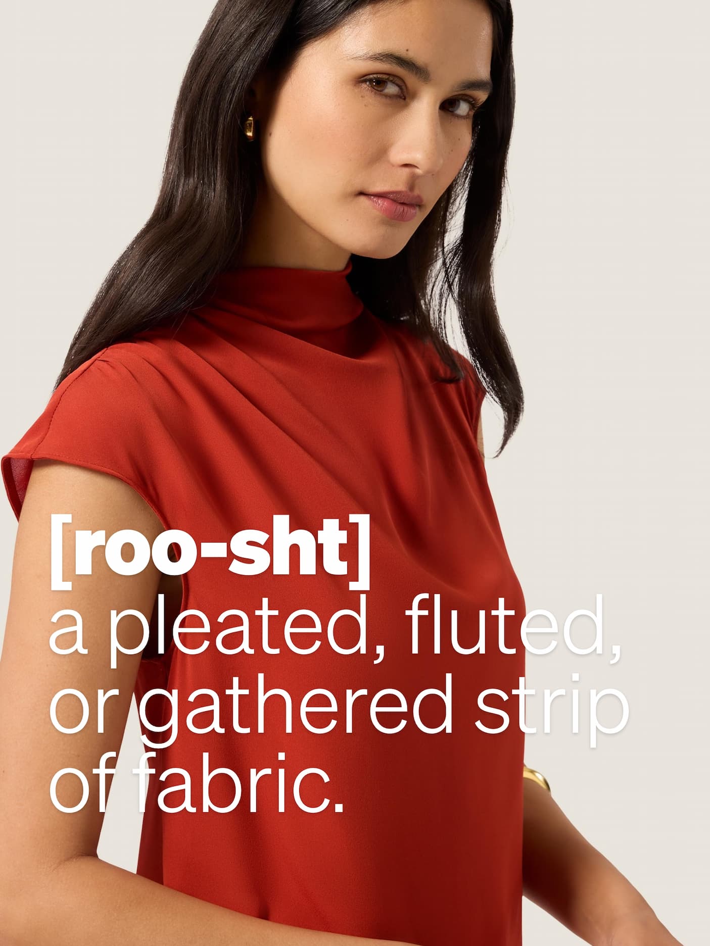 [roo-sht] a pleated, fluted, or gathered strip of fabric.