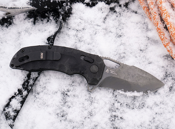 Comes in blackout micarta or orange g10