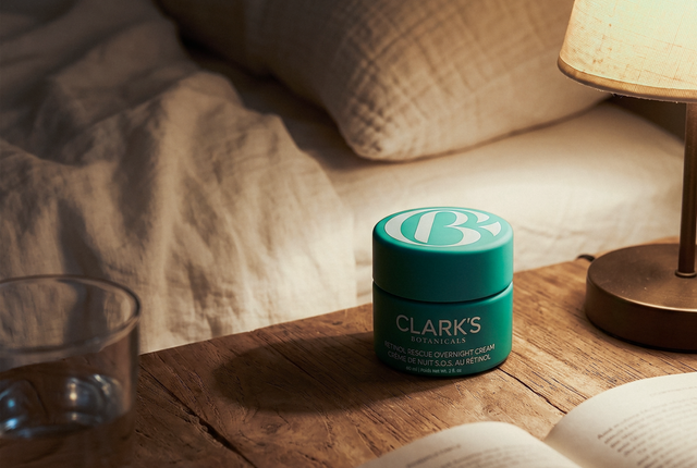 Retinol Rescue Overnight Cream on a bedside table in warm lamplight