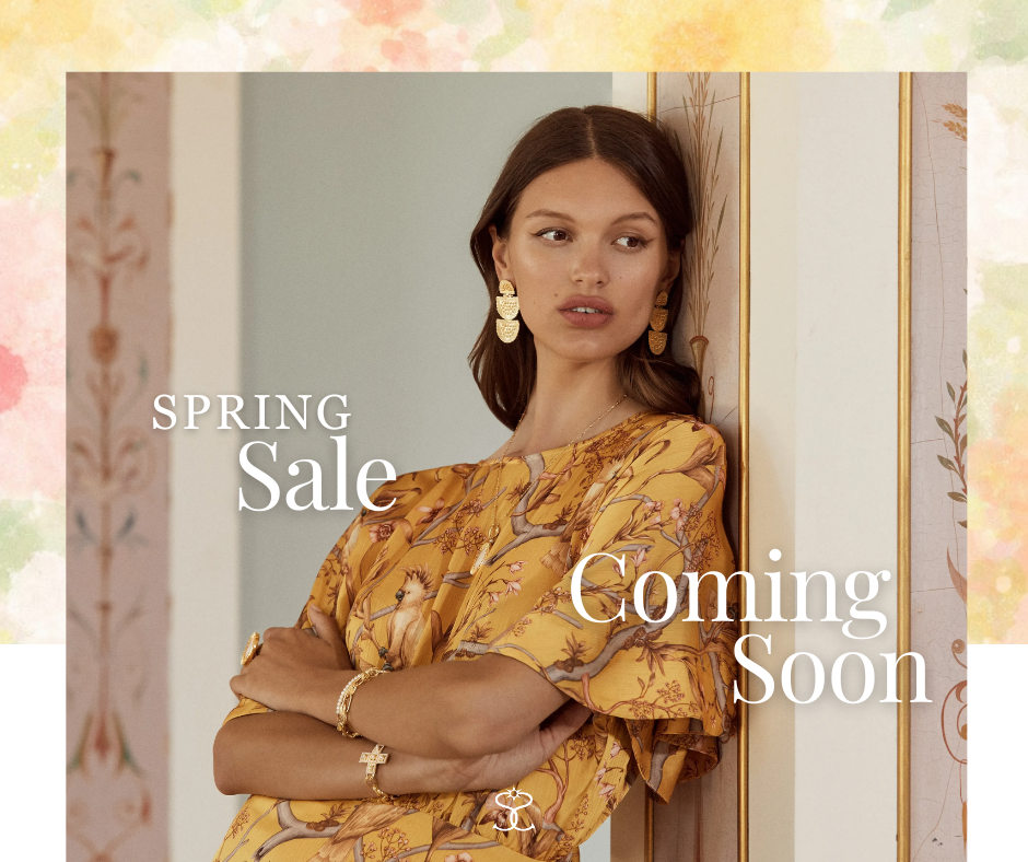 A photo of a charm necklace featuring a small angel with "new for mother's day"