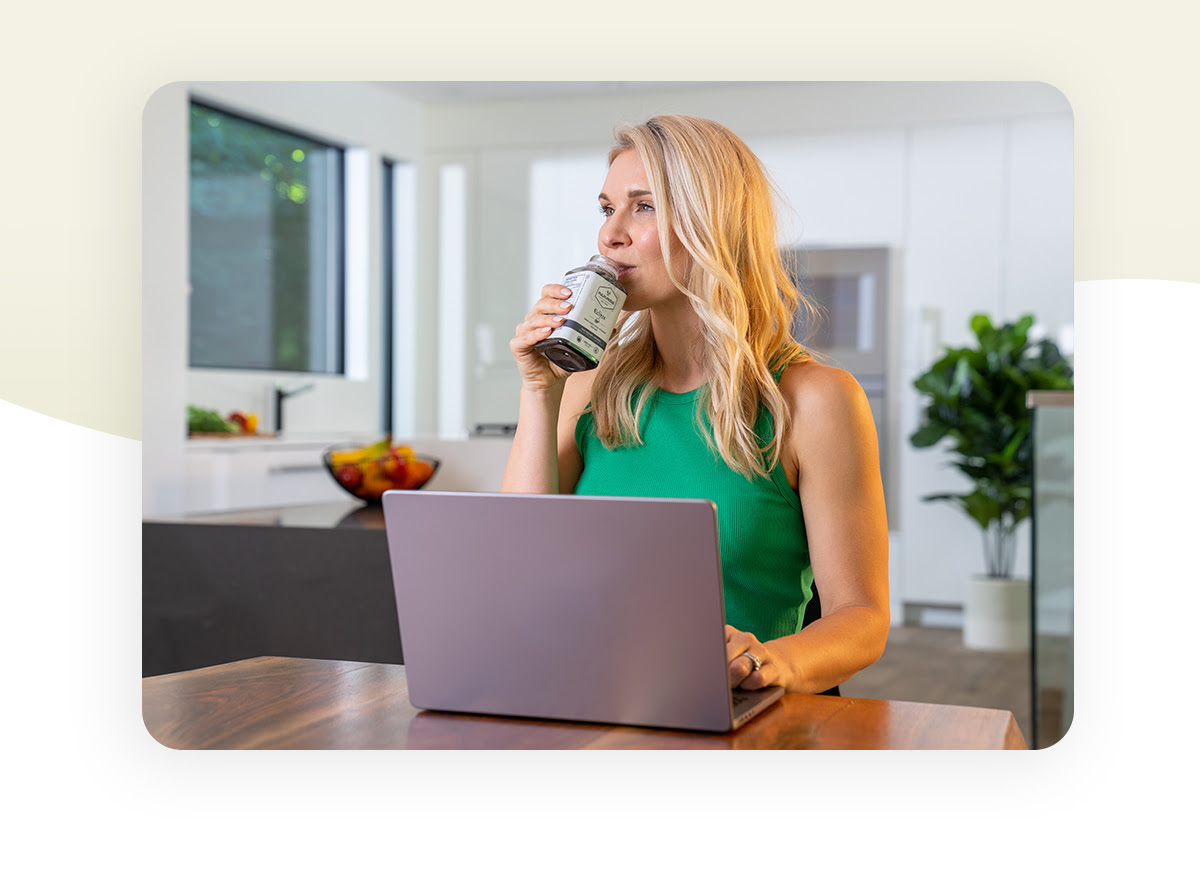 Woman drinking Pulp & Press.