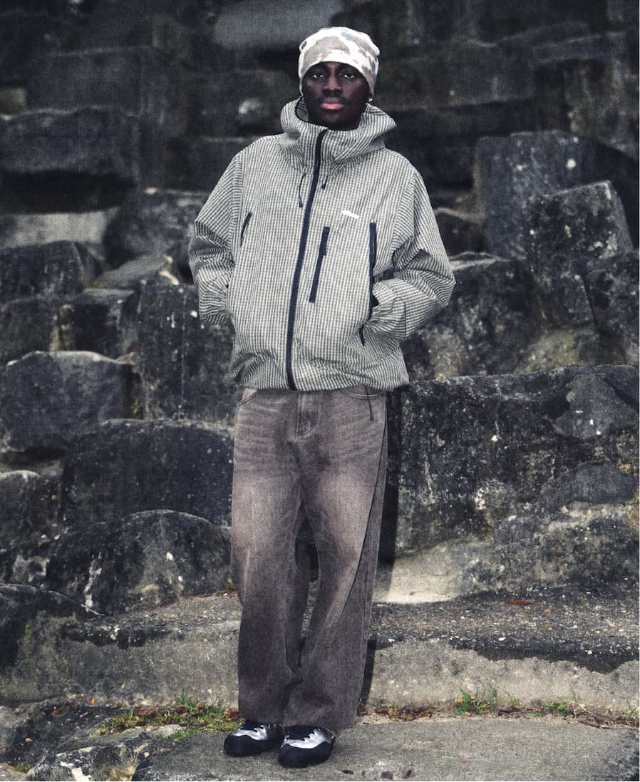 Men model standing in front of rocks wearing Obey fall collection 2026