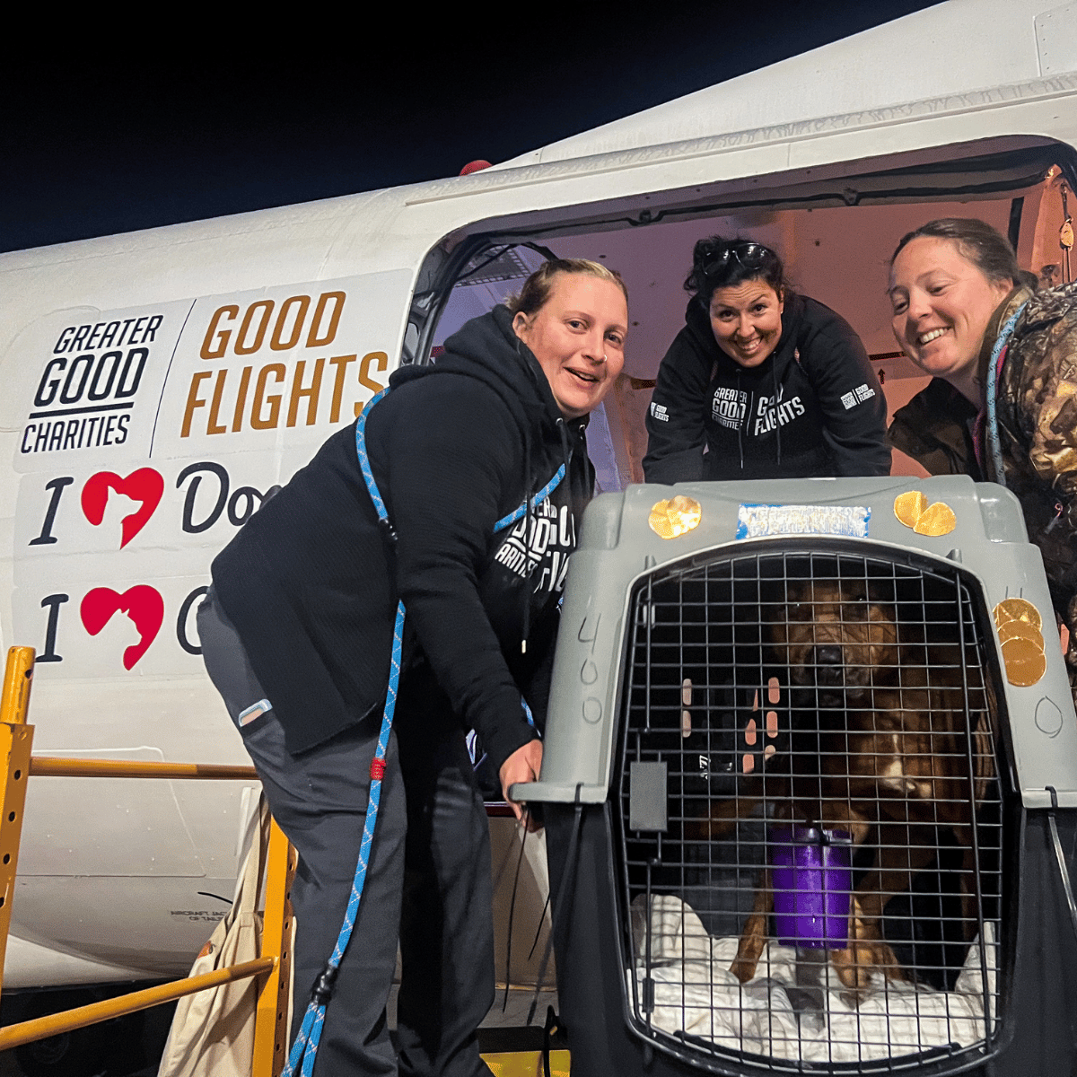 3 women unloading a shelter dog to their second chance at life in Wisconsin