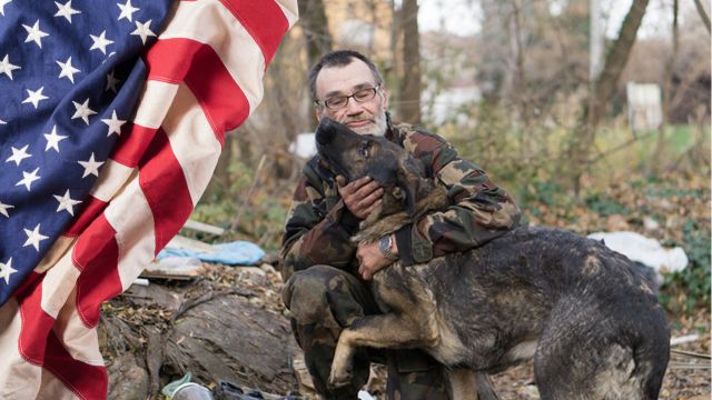 Man outside with dog.