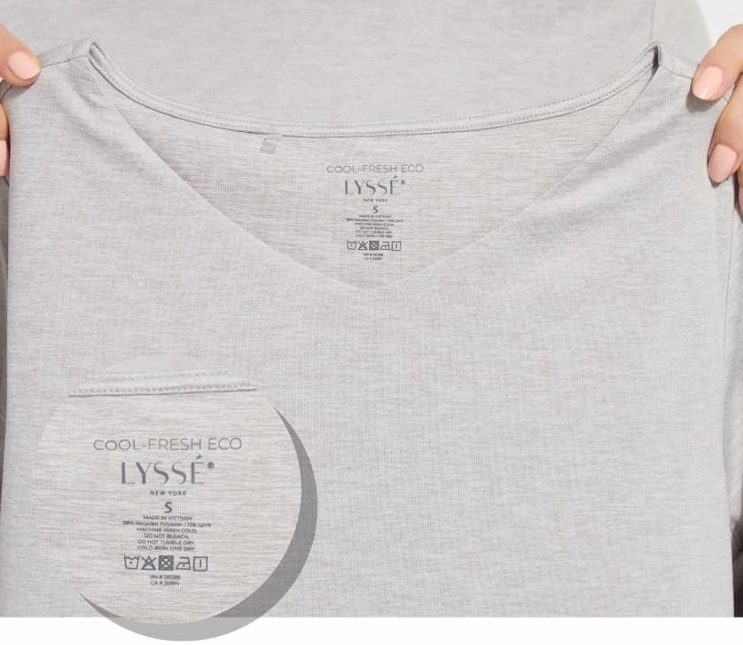 Close-up of COOL-FRESH™ ECO Jersey tag highlighting its recycled fabric and cooling properties.