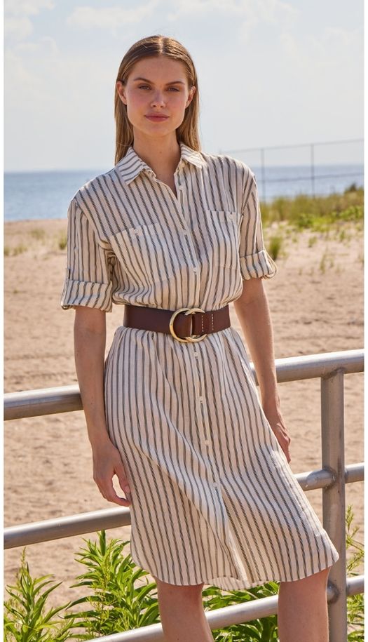 Lightweight linen tunic shirt dress with removable belt, rolled tab sleeves, front pockets and relaxed spring silhouette.
