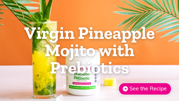 glass of virgin pineapple mojito with prebiotics next to bottle of Just Thrive PREbiotic