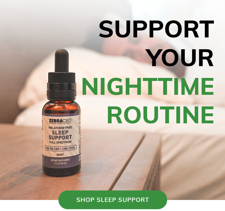 A bottle of Zebra CBD Melatonin-Free Sleep Support Full Spectrum Mint oil dropper stands on a wooden nightstand. In the softly blurred background, a person is lying comfortably asleep in a bed with white sheets and pillows. Bold text overlay reads "SUPPORT YOUR NIGHTTIME ROUTINE" in black and green, and a green button at the bottom reads "SHOP SLEEP SUPPORT".