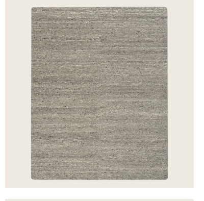  Modern grey sofa on textured carpet in well-lit room interior. Distressed Solid Rug - Grey-7'9 Stylish interior scene with book, plant, and textured carpet. Modern room with gradient rug, sleek furniture, and decorative accents. Close-up of loop pile carpet in neutral color with stains. Close-up view of grey textured carpet on dark wood floor. Two layered rugs with textured and looped designs on floor. abc carpet & home  Grey Essentials Distressed Solid Wool Rug