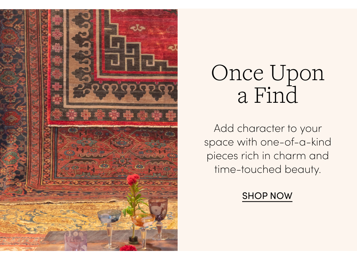 Vintage rugs handing with a vintage coffee table and glassware