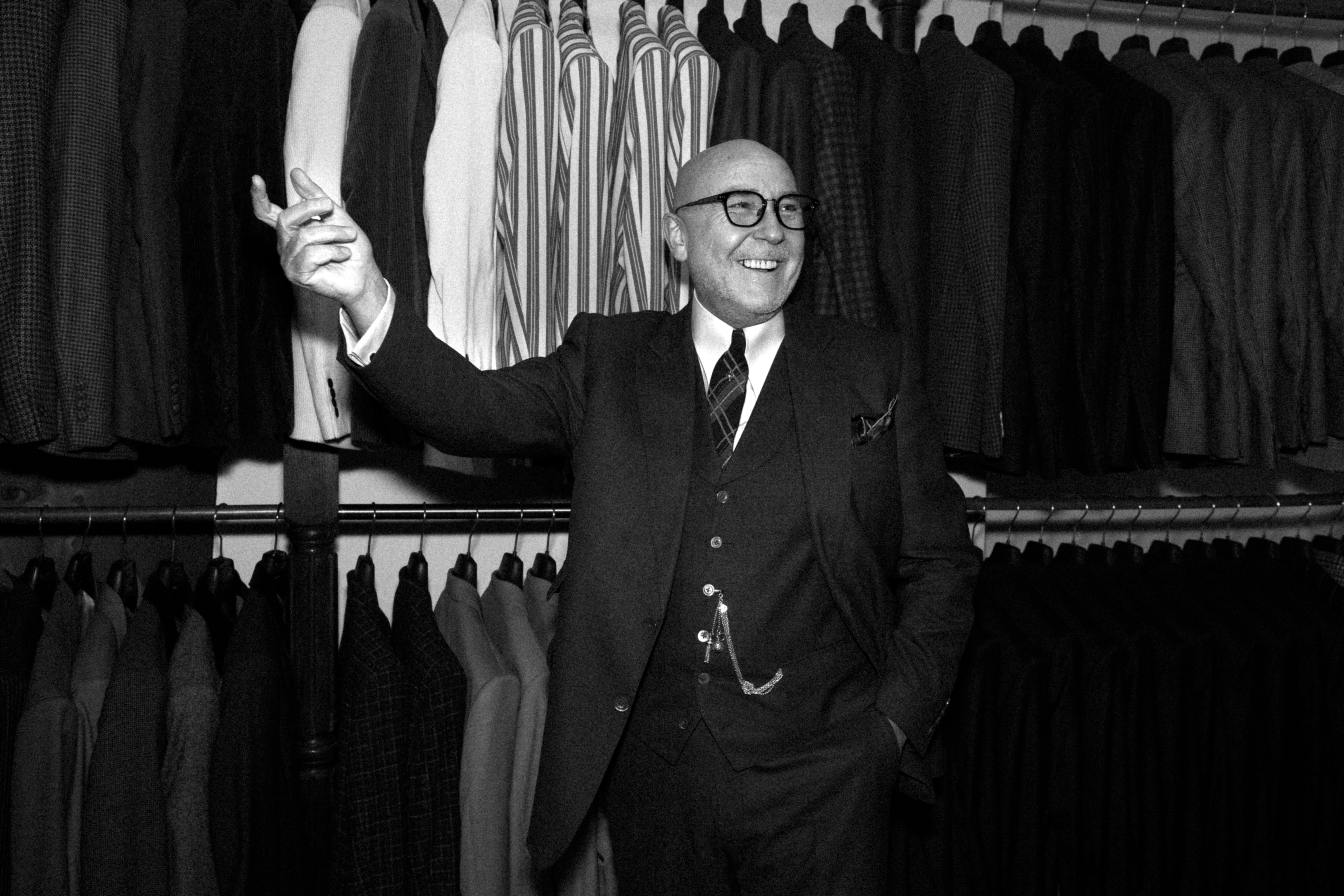 mark powell in front of suits