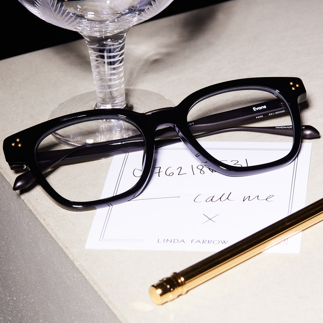mens glasses on a note that says call me