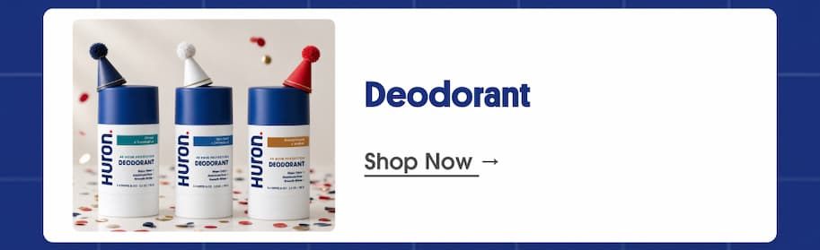 Three Huron deodorant sticks wearing party hats on confetti background, next to the heading "Deodorant" and a "Shop Now" link