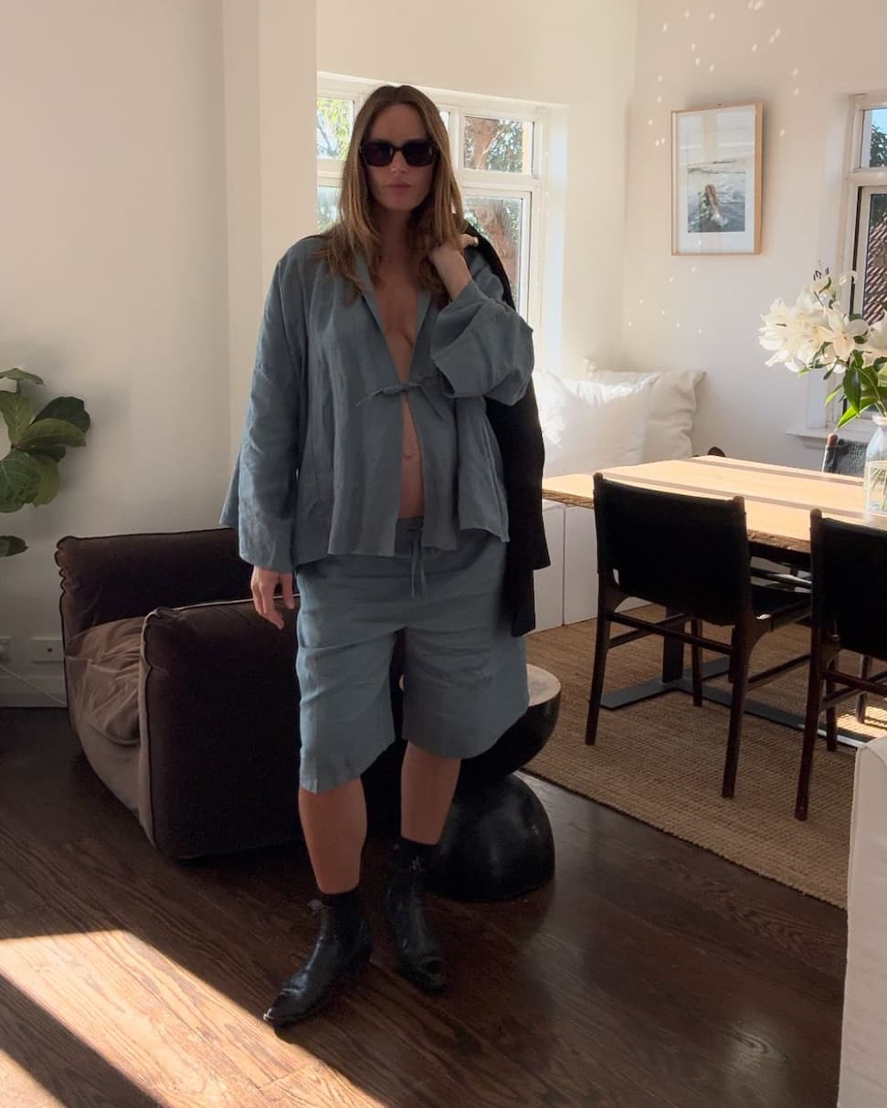 The Koko linen shorts styled with a sweatshirt, off-duty maternity look
