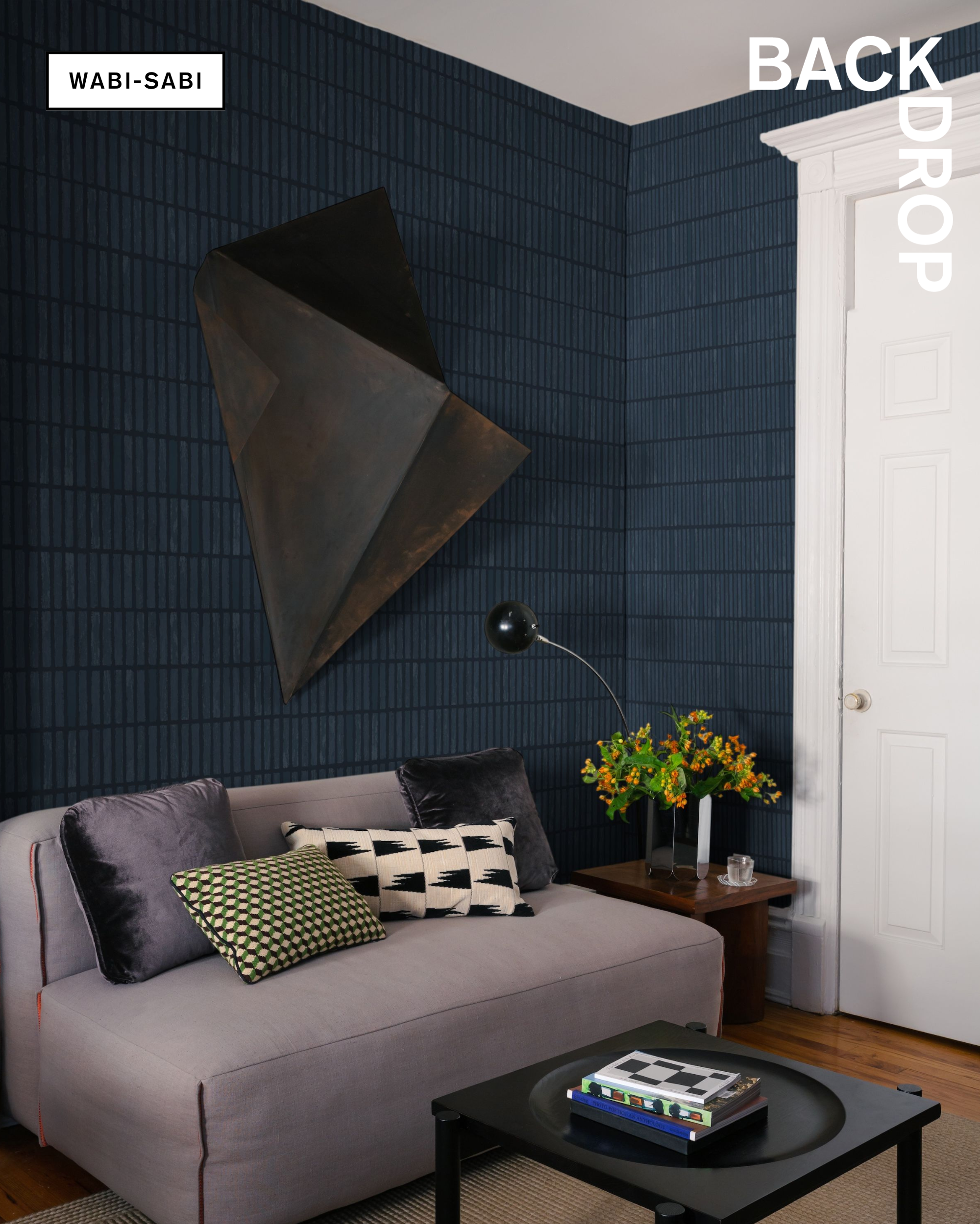 Backdrop's geometric wallpaper, WABI-SABI, in Dark Blue installed in an apartment's living room.
