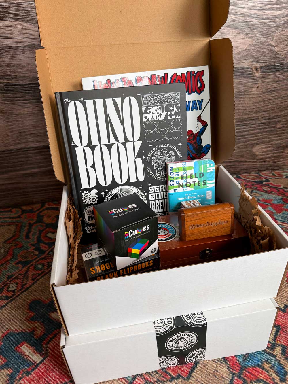 Example of goods in the I Want It All Box. Packed up box on bottom.