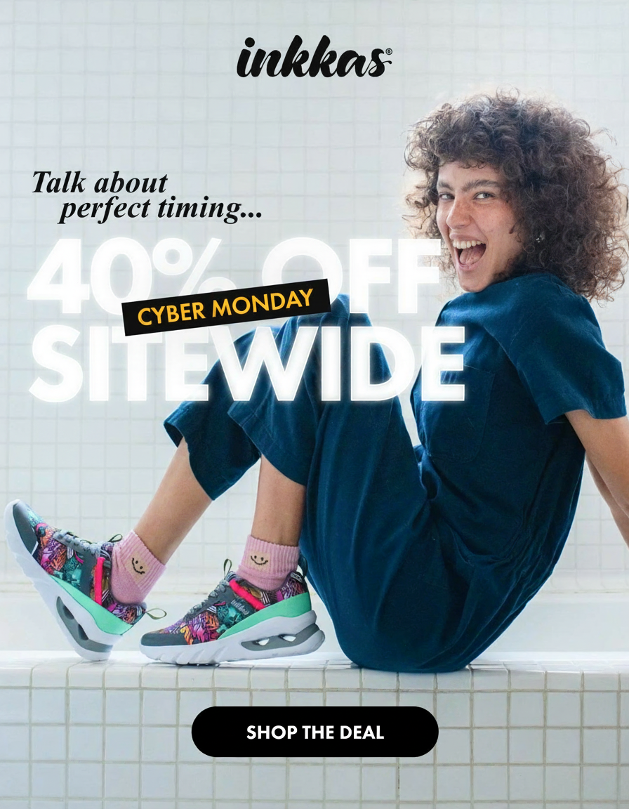 an image of a woman sitting on a bathtub with her feet up and a smile on her