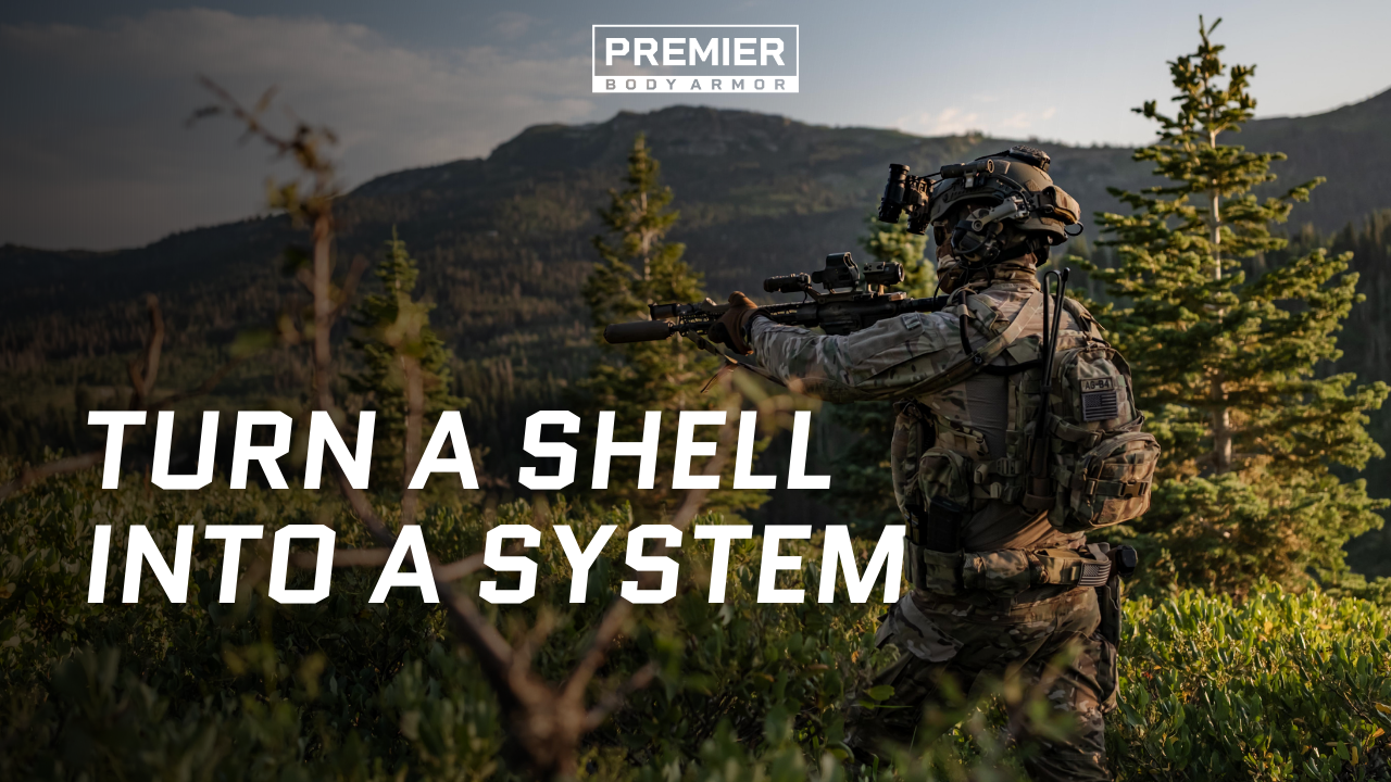 Operator in mountainous terrain wearing a tactical helmet with mounted NVG and light.