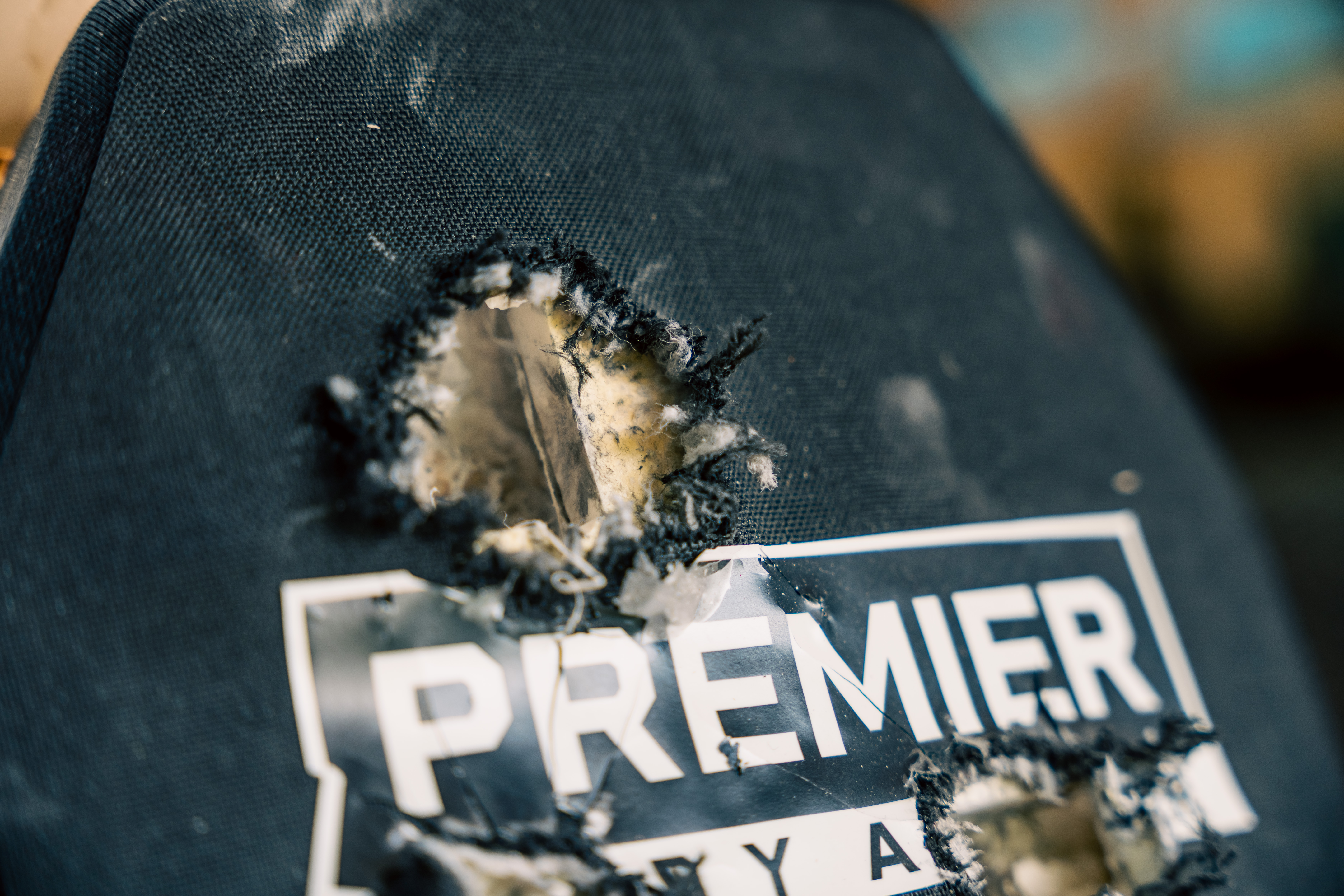 image of body armor plate showing where a round entered and was stopped