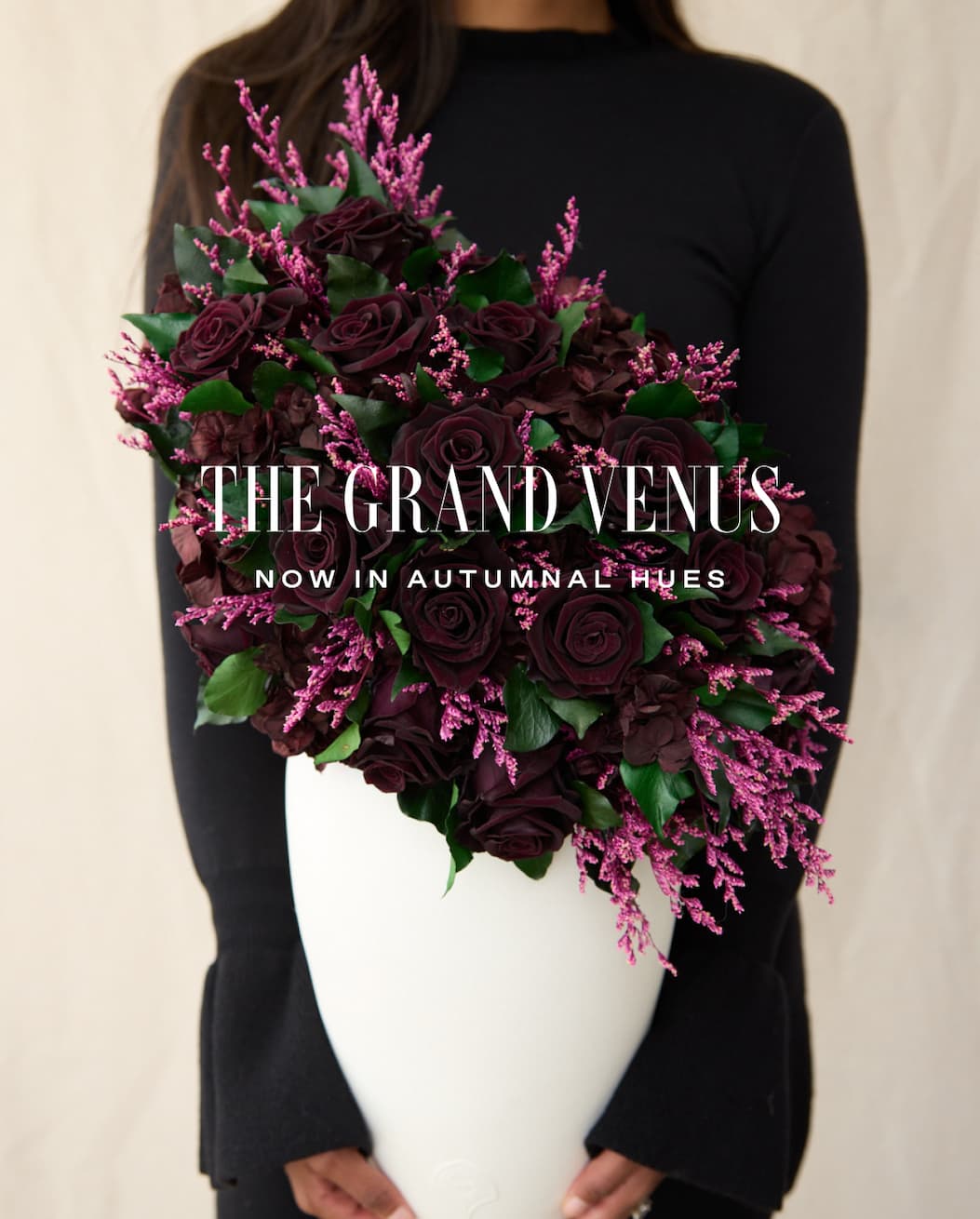 A vertical collage on a plum backdrop presenting the Fall palette and textures: a dew-kissed near-black rose, clusters of blackberries, wine-toned leaves, a white x-ray flower, multiple antiquity-inspired vessels (porcelain, clay, travertine; including a grid of ancient pots and a tall Egyptian amphora), a classical 'Flora' fresco and figure sketch, and a paint roller laying down an oxblood swatch—signaling a moody, museum-worthy direction for the Fall collection.