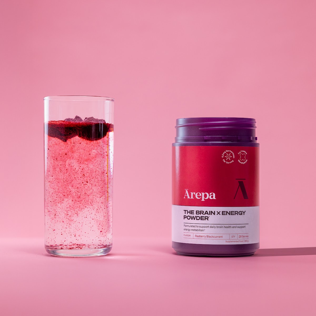 Ārepa Brain x Energy Powder made up in a glass beside the tub