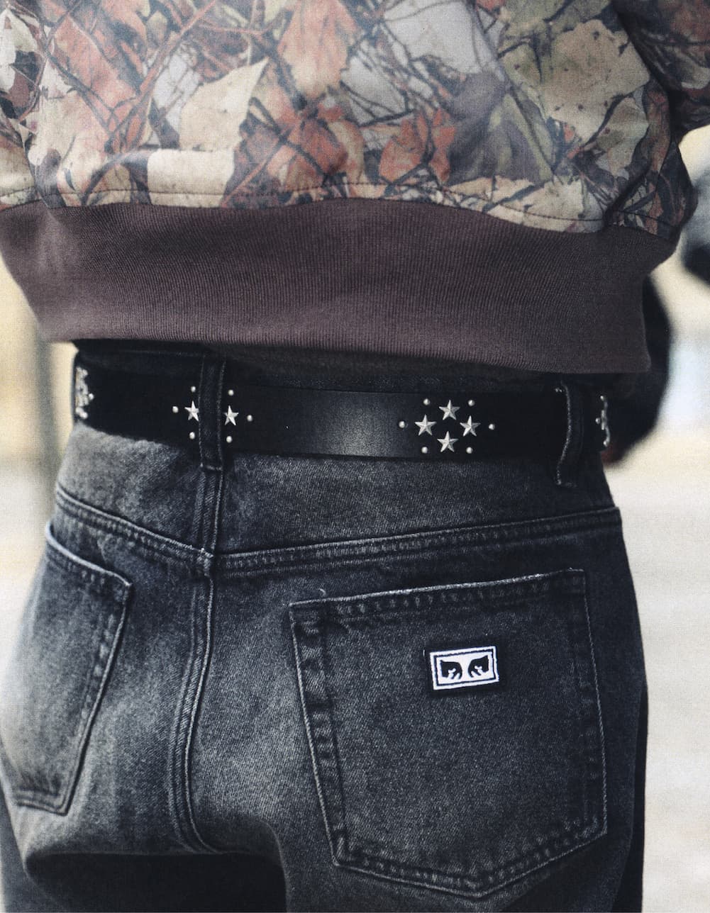 Up close image of a male model wearing OBEY belt from fall collection 2026