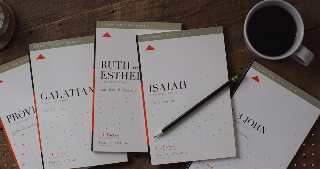 an image of a table with a bunch of books and a cup of coffee