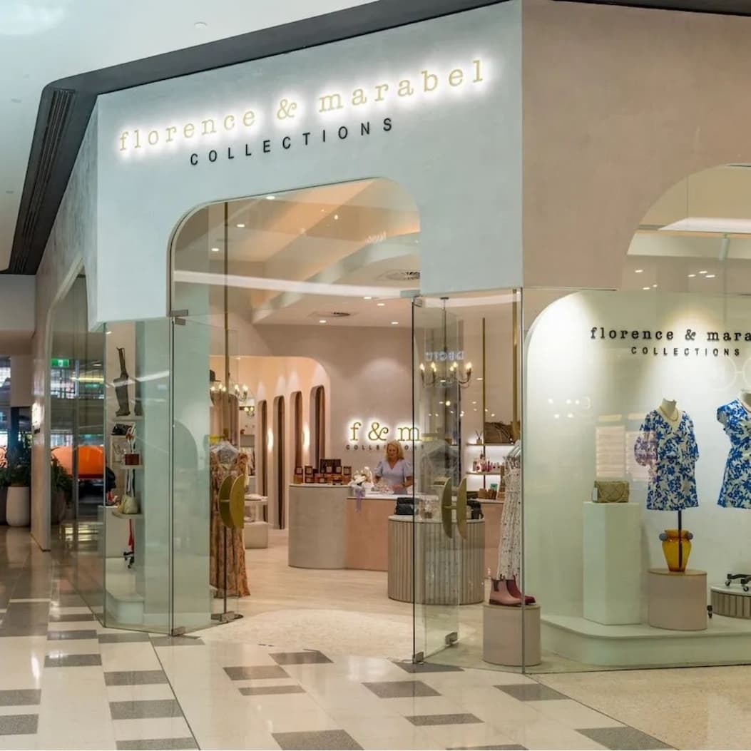 an image of a store with a glass door and a sign