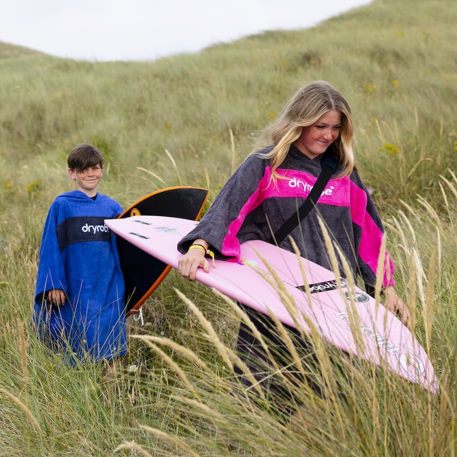 Two young people wearing Kids Organic Towel Dryrobe®