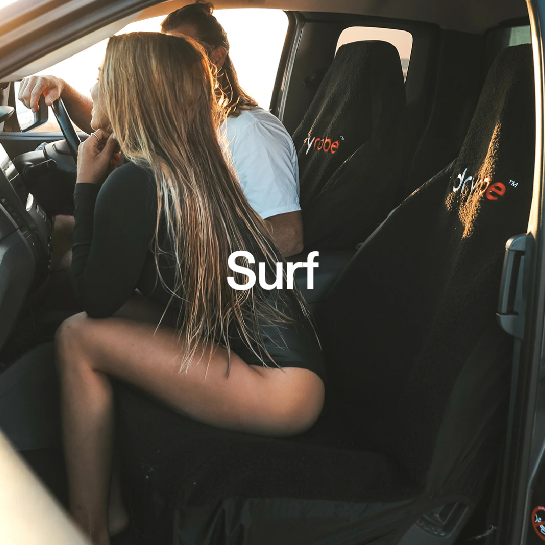 Man and woman in a camper van wearing beachwear