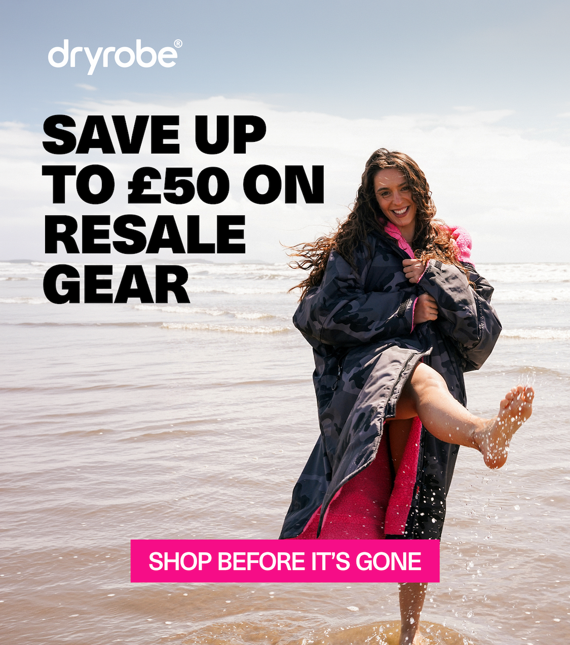 Dryrobe® Advance changing robes being dropped onto the beach