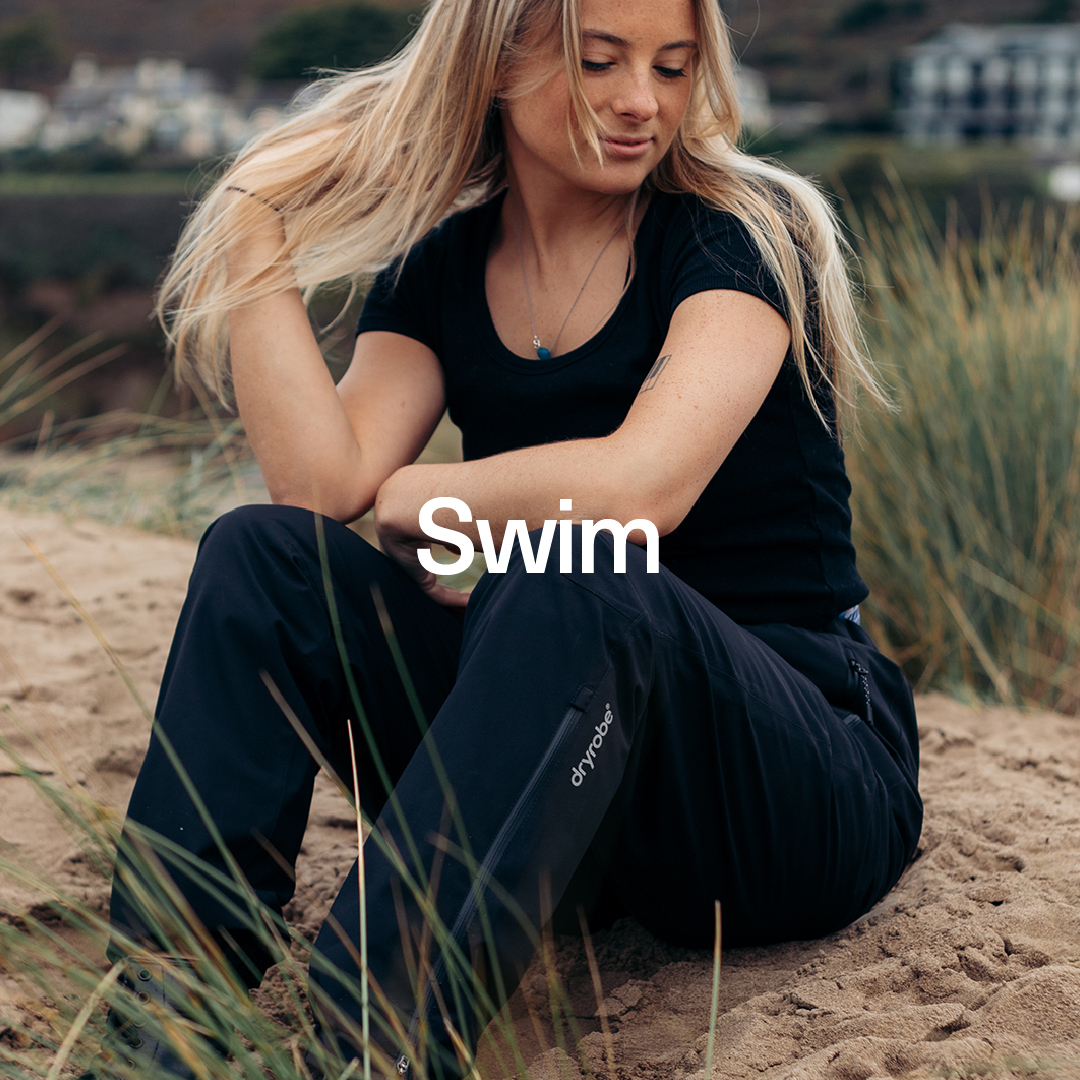 Woman sat on the sand dunes