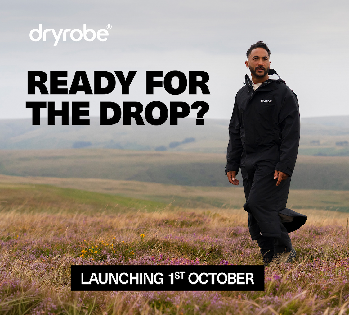 Man on the moors wearing Dryrobe® Waterproof Parka in Black