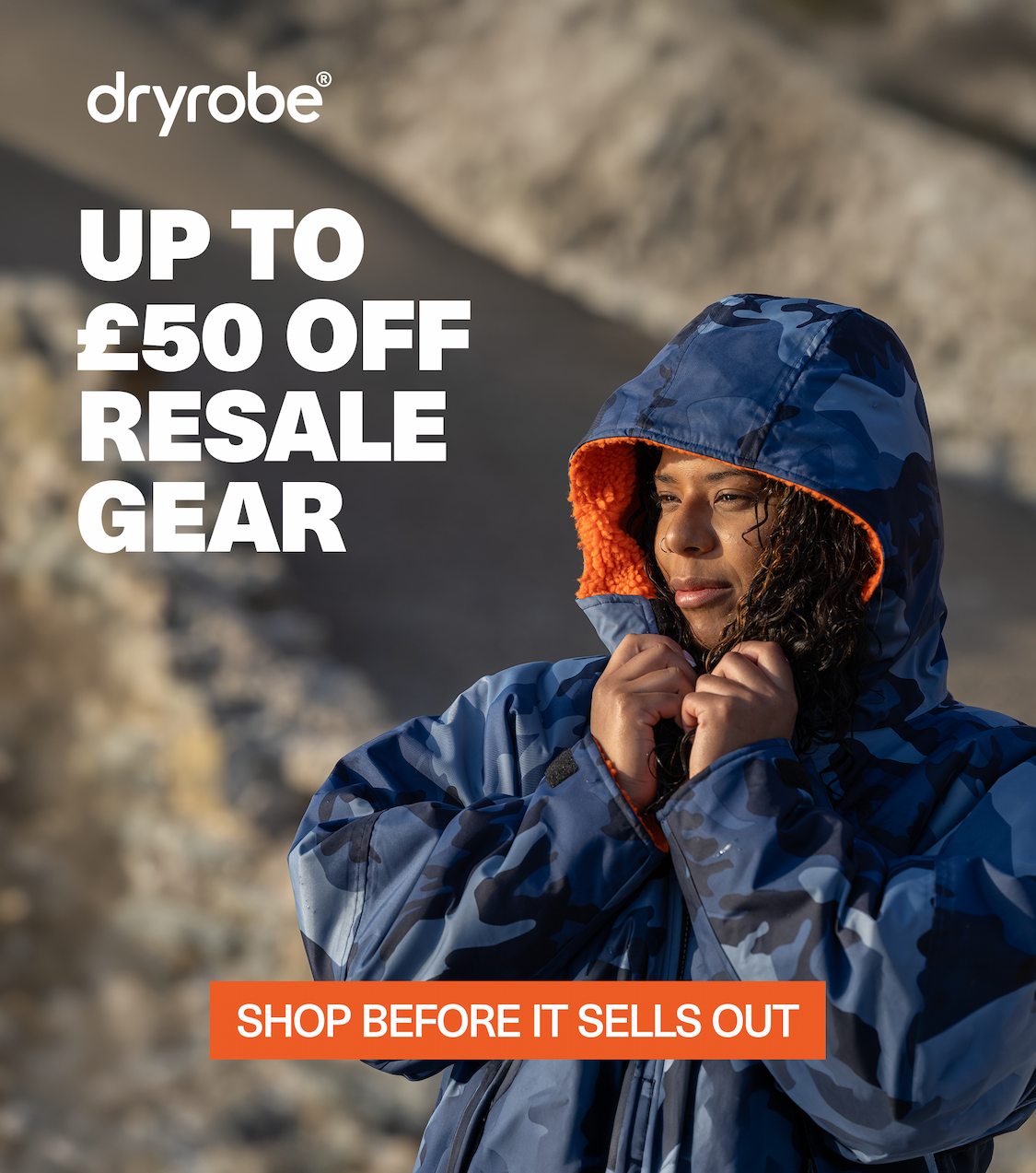 Dryrobe® Advance changing robes being dropped onto the beach