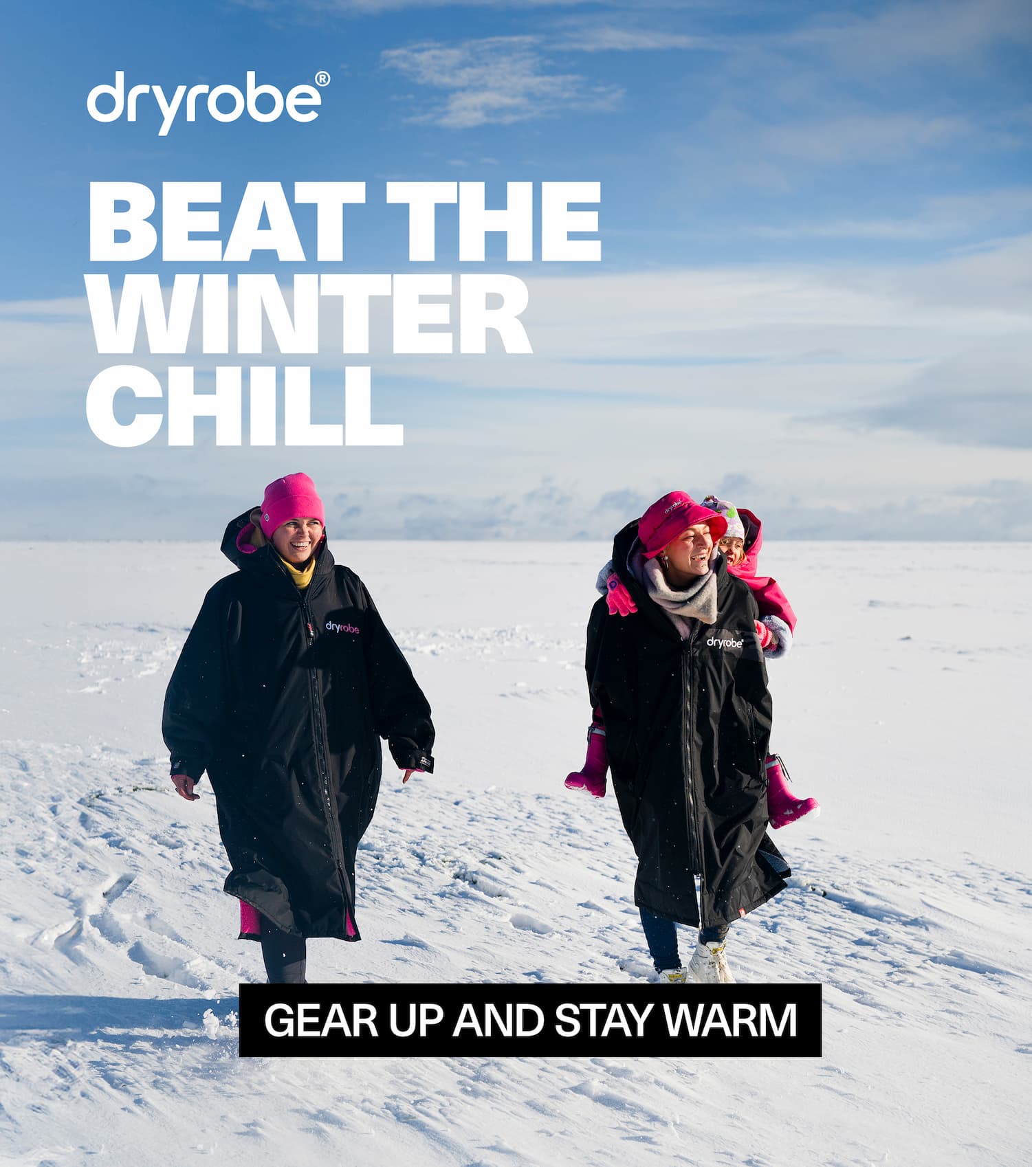 Two women and a child walking through the snow while wrapped in warm layers