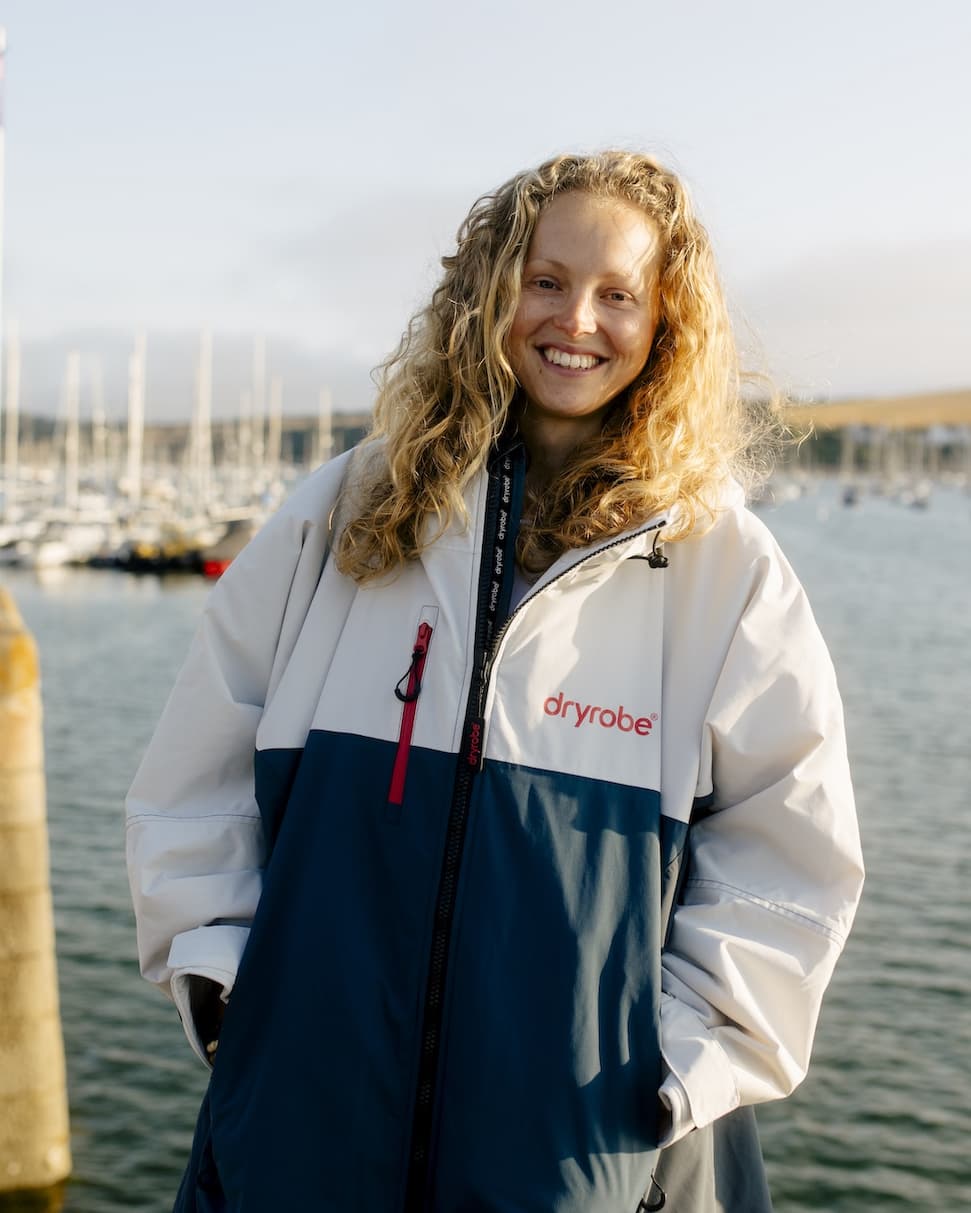 Smiling woman wearing a Limited Edition RNLI Dryrobe® Nexus