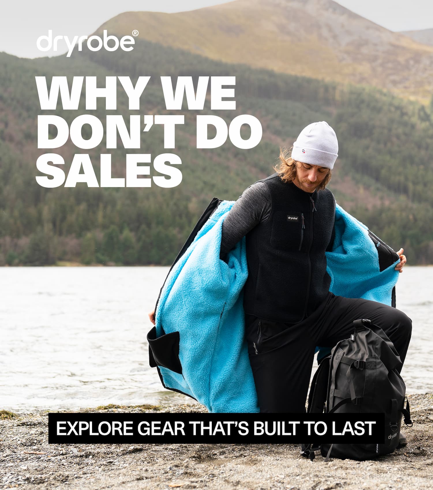 Male wearing dryrobe® gear with a glowing mountain in the backdrop