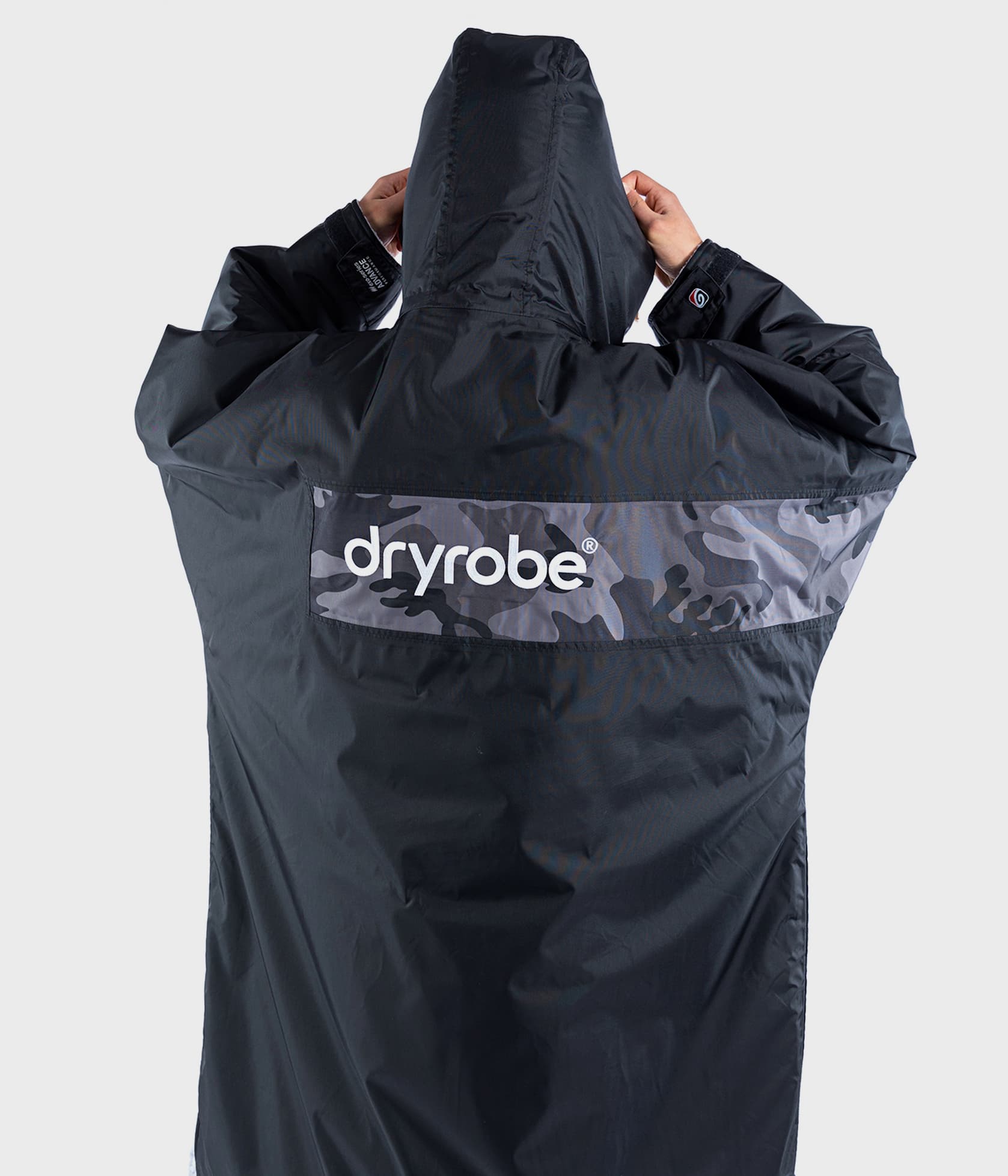 Man wearing Dryrobe® Advance in Black Grey Camo