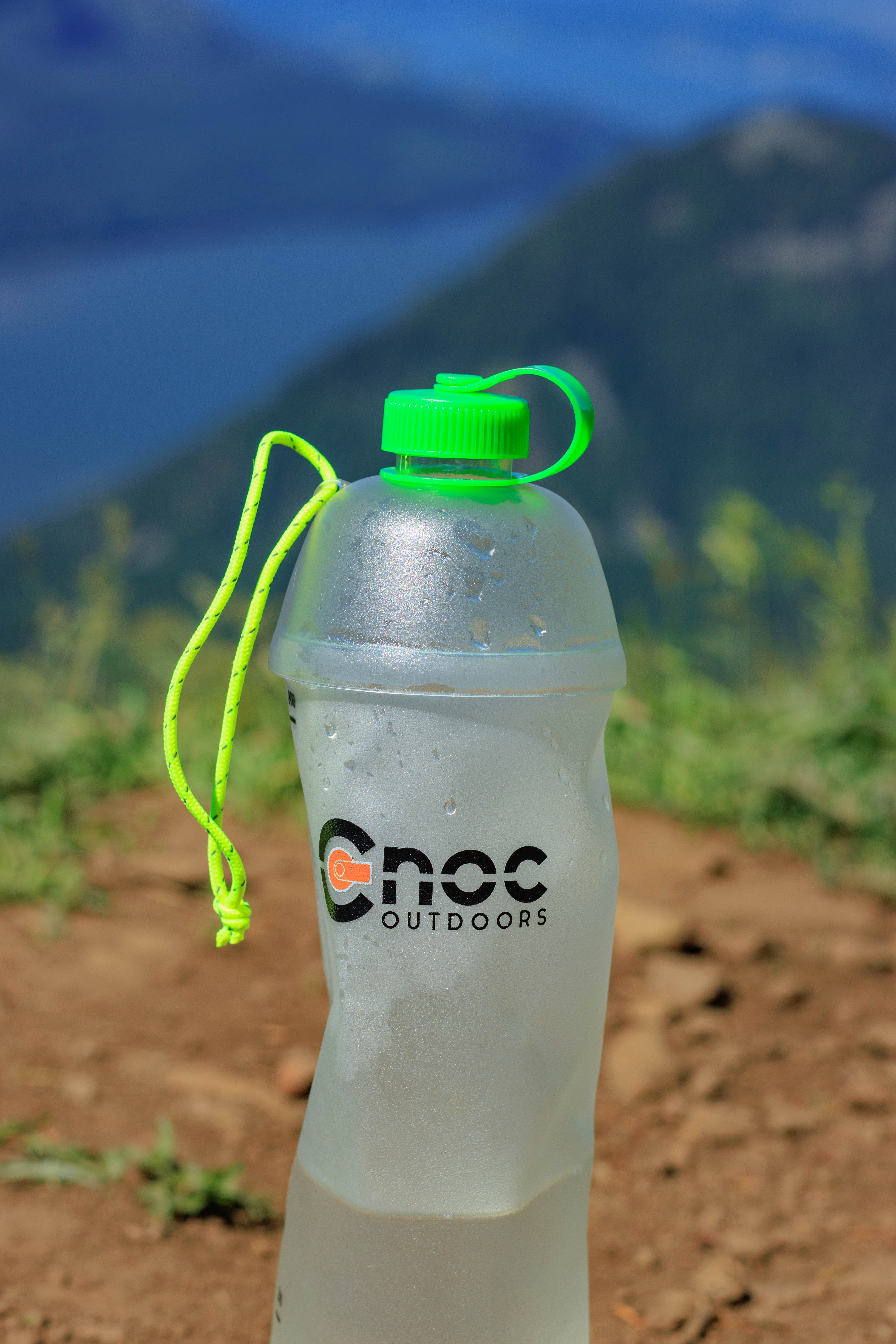 A half full Vesica place upright in front of a view