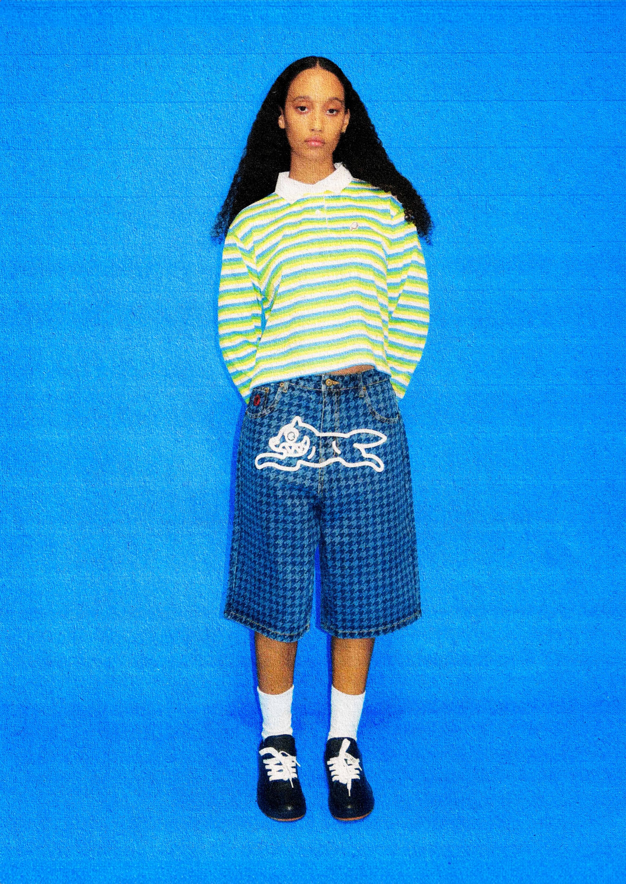 an image of a young girl standing in a blue room