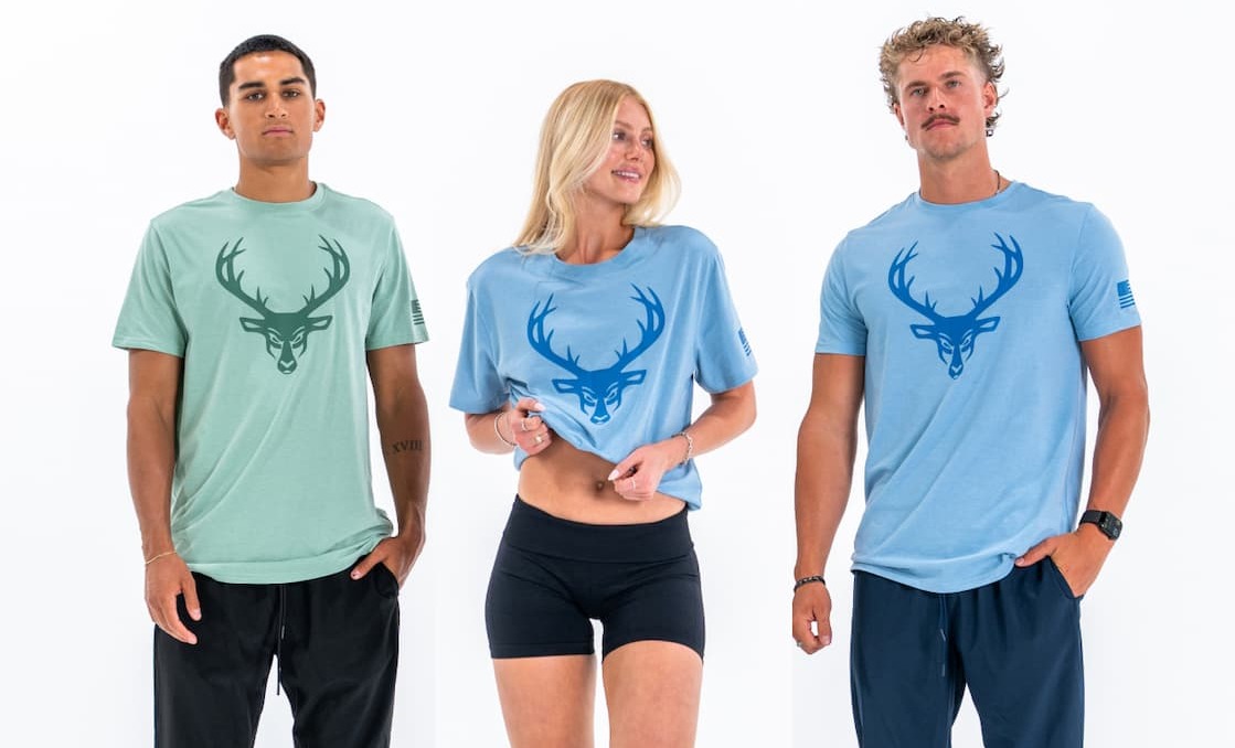 Five views of the Bucked Up Flag Tee in white, olive, and black colorways featuring the Bucked Up buck logo and American flag sleeve detail