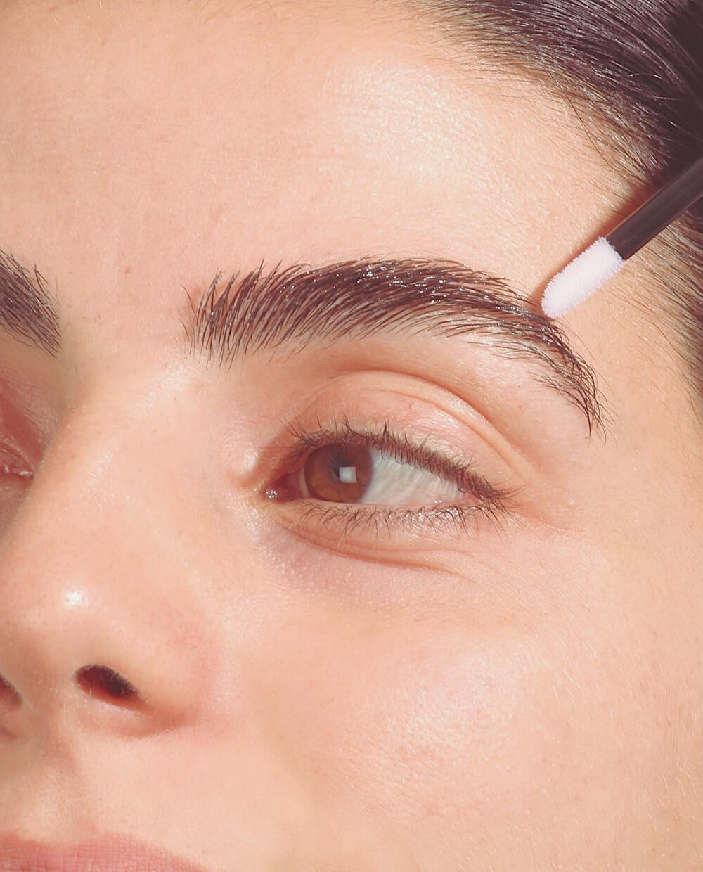 Female applying The Brown Bond